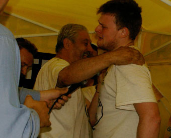Barking Joe hugs Silent John